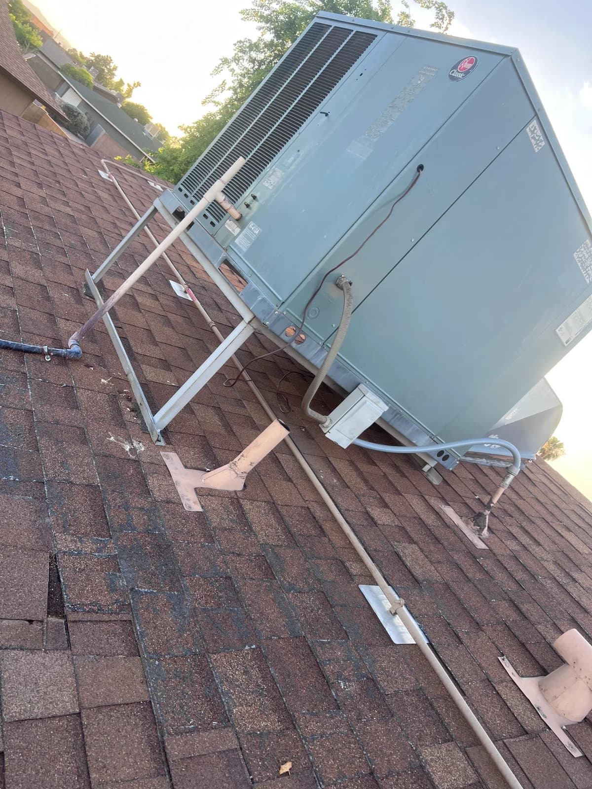 Aging rooftop packaged HVAC unit before replacement, viewed from the side