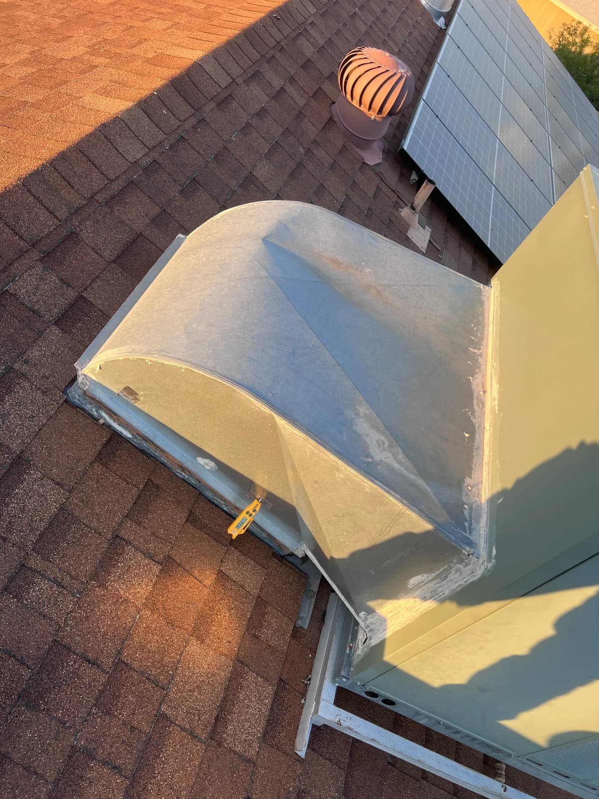 Original rooftop duct transition and equipment connection before replacement