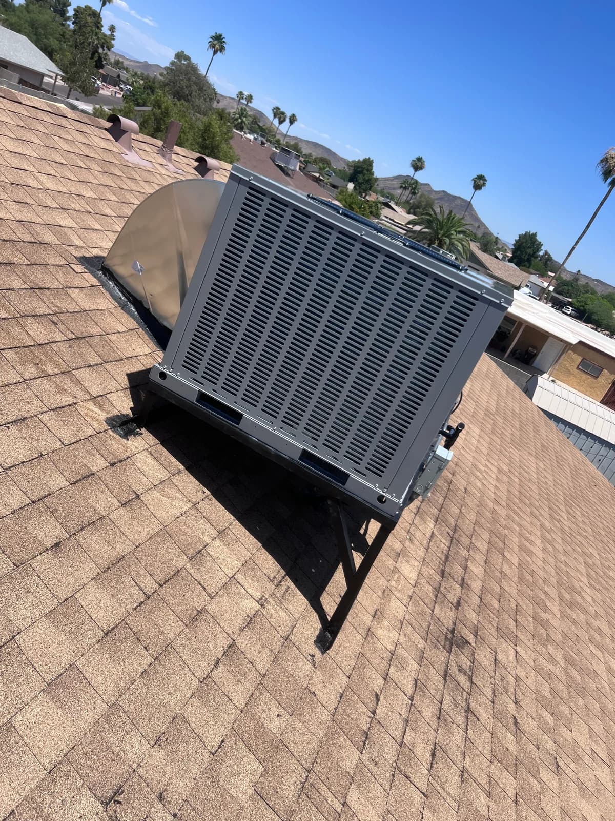 Completed rooftop equipment installation viewed from the rear