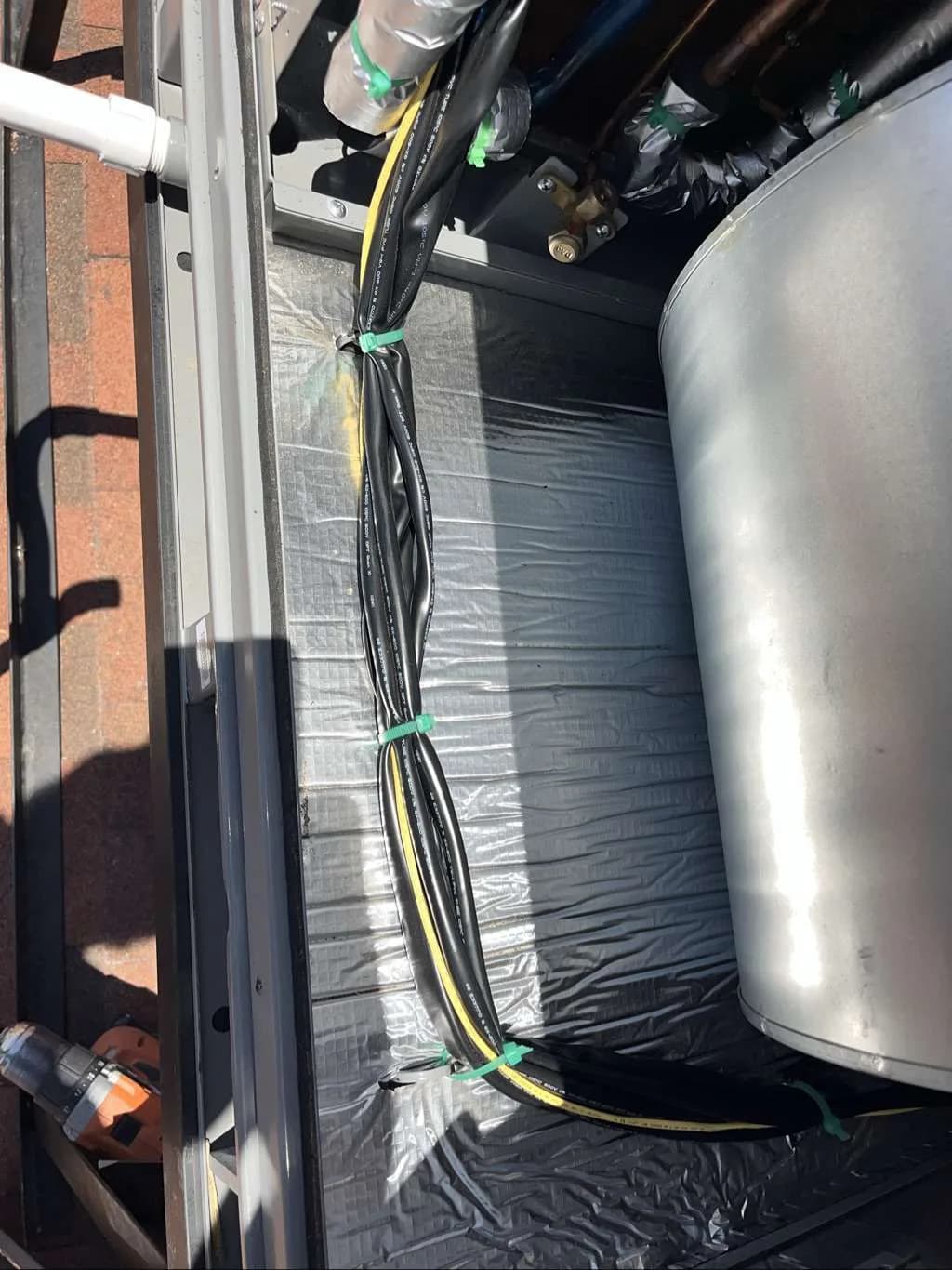 Open HVAC compartment showing wiring, metalwork, and the internal blower area