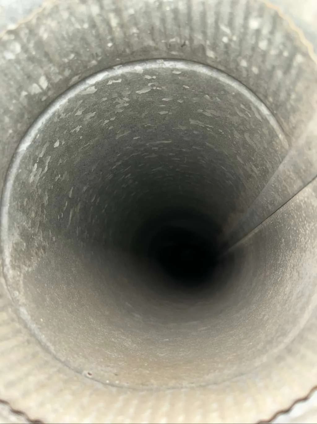 View through the round duct connection during the system inspection