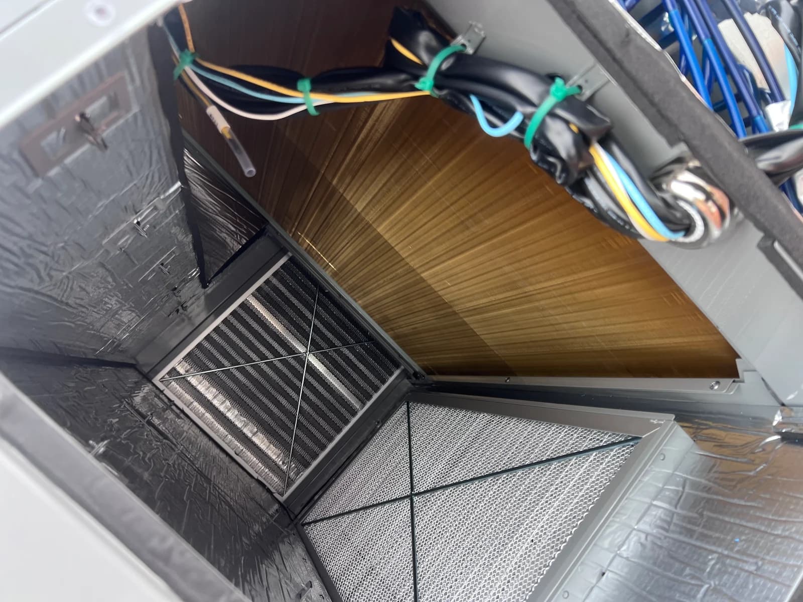 Internal coil, filter area, and wiring visible during component service