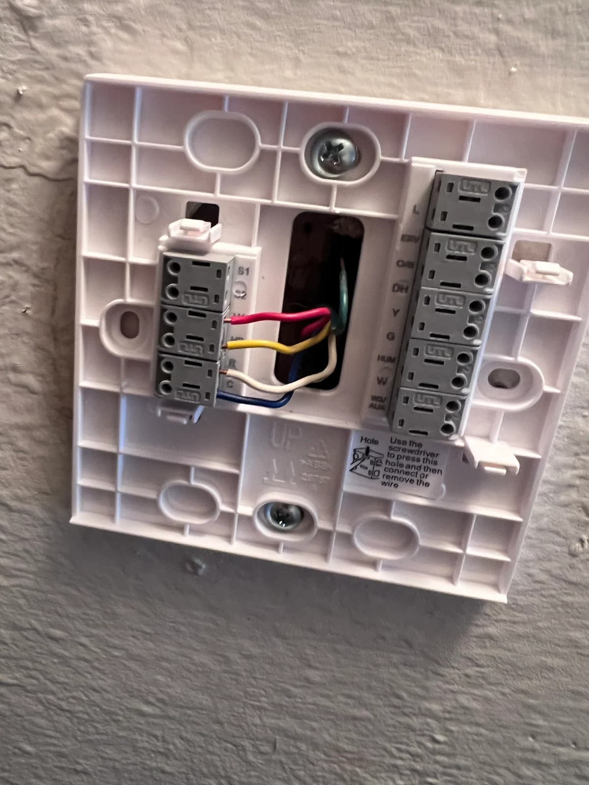 Thermostat wall plate and wiring prepared for the control connection